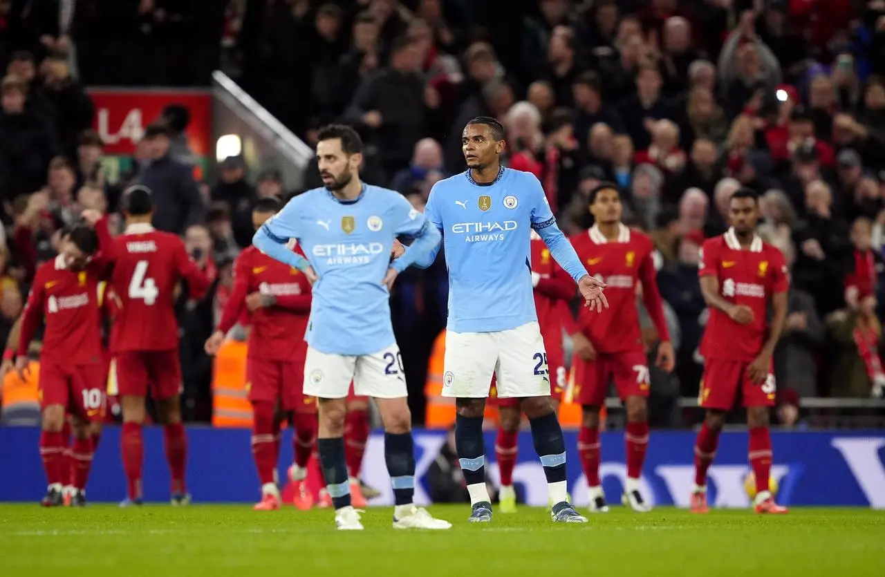 Manchester City’s Bernardo Silva and Manuel Akanji react after they concede a second goal during the Premier League defeat at Liverpool.