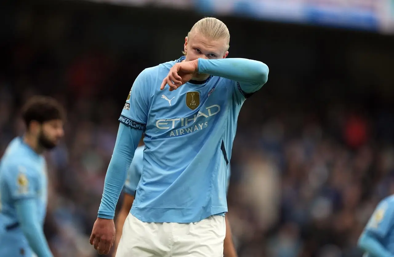 Manchester City’s Erling Haaland covers his mouth with his arm