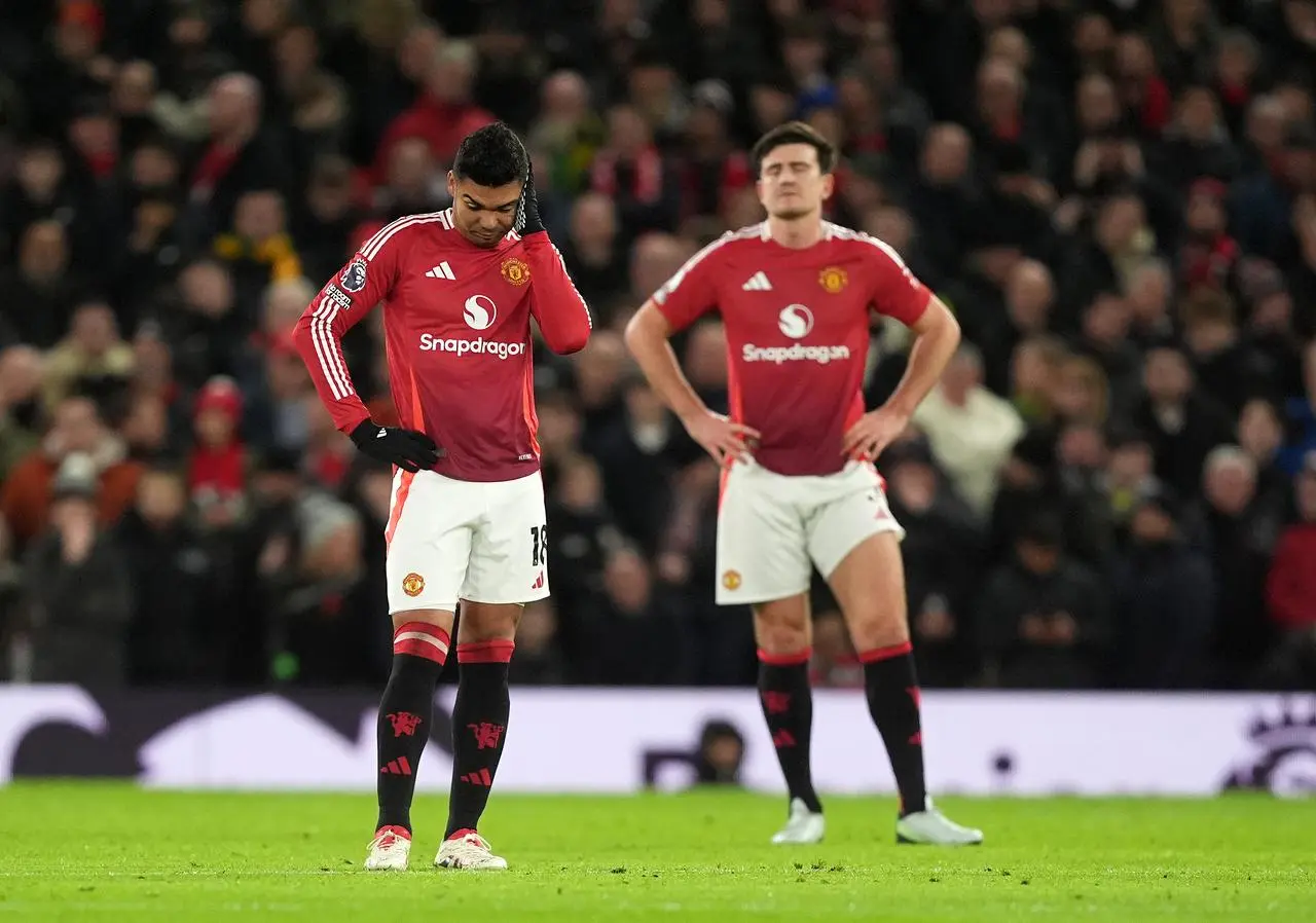 Casemiro and Harry Maguire look dejected after conceding 