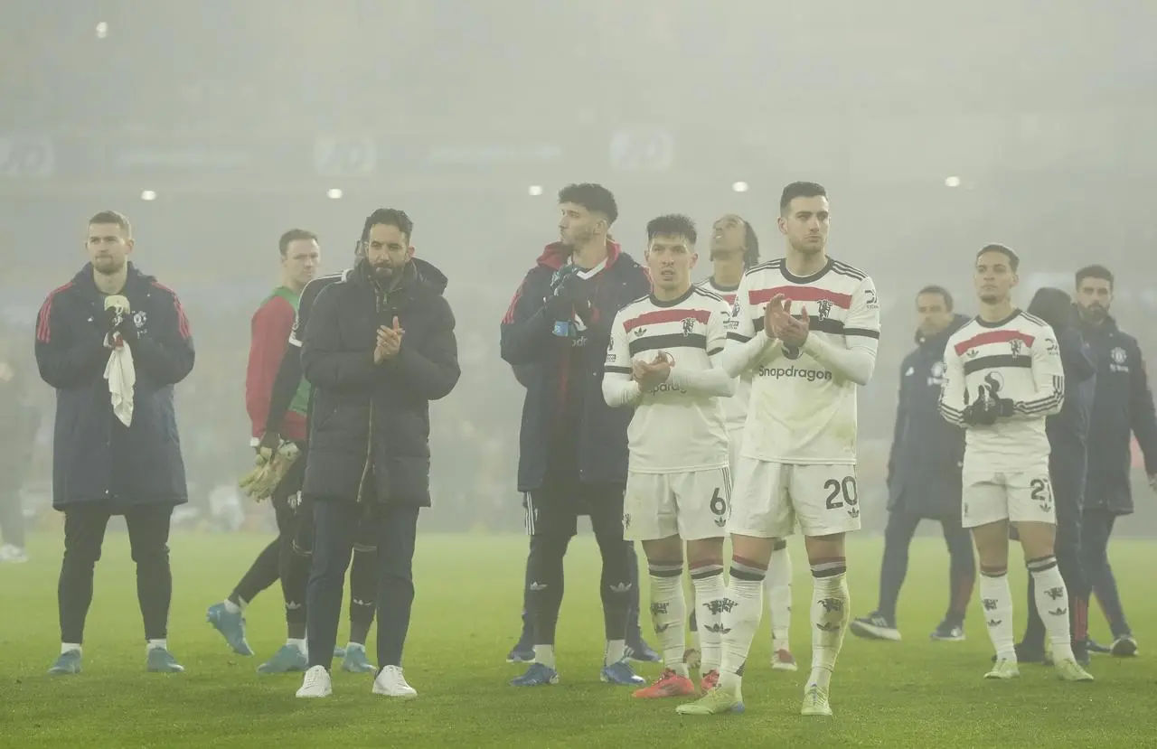 Ruben Amorim (second left) and his players applaud the fans