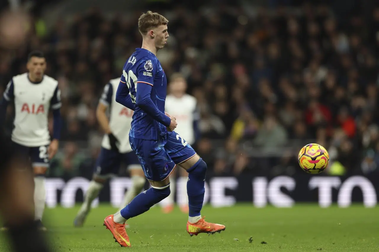 Chelsea's Cole Palmer scores a Panenka penalty against Tottenham