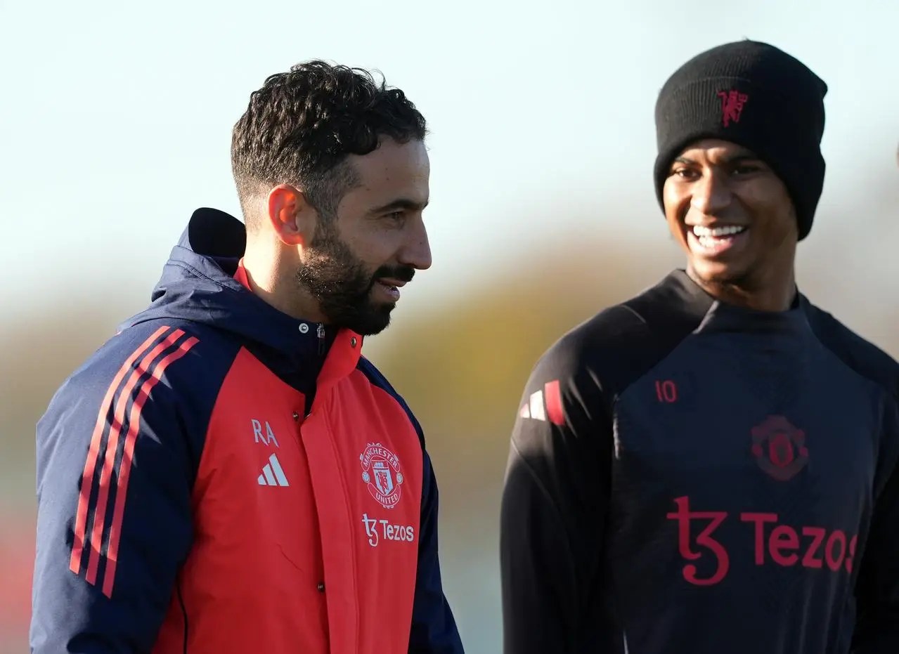 Manchester United manager Ruben Amorim with Marcus Rashford during a training session