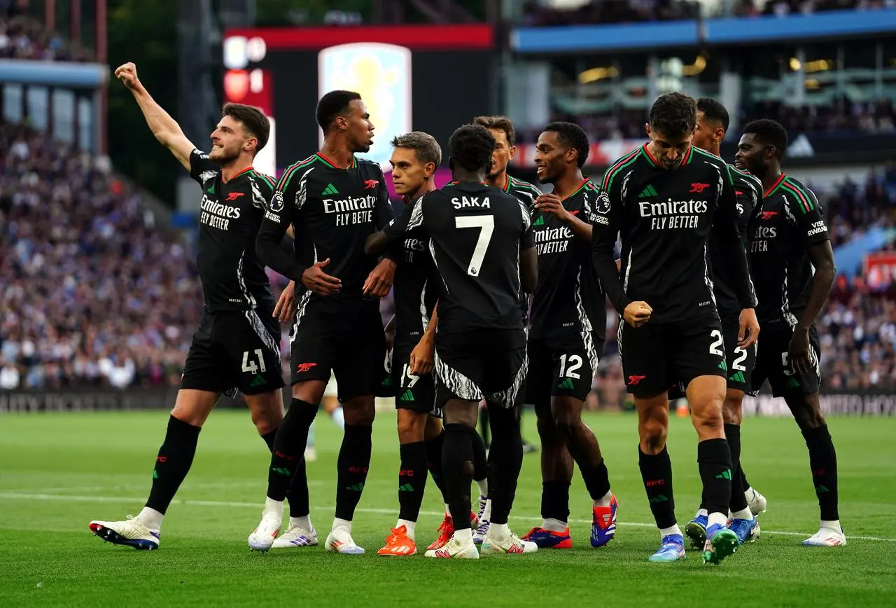 Arsenal players celebrate Leandro Trossard's goal in their 2-0 win at Aston Villa in August