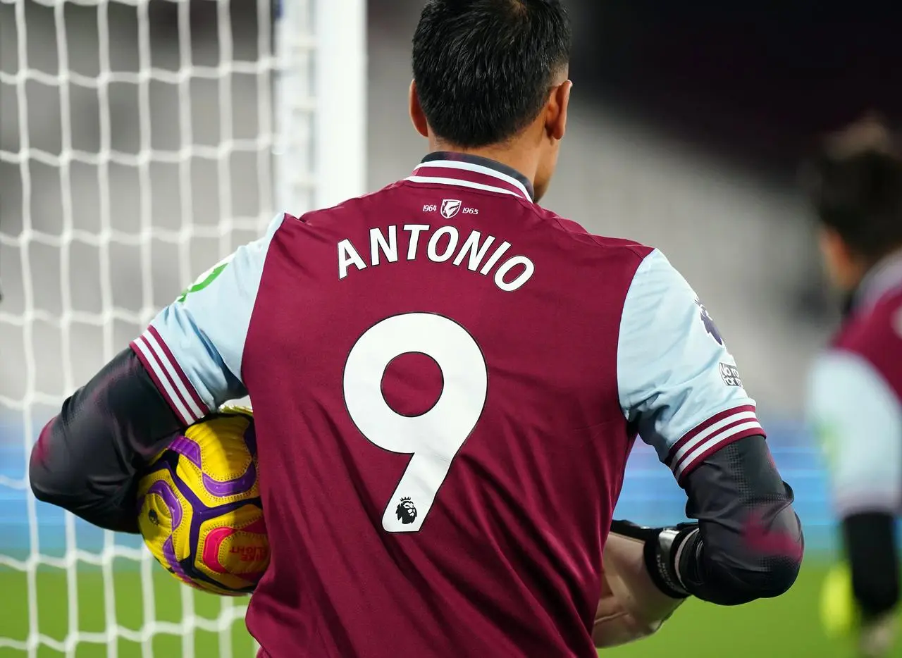 A West Ham player warming up in an 'Antonio 9' shirt