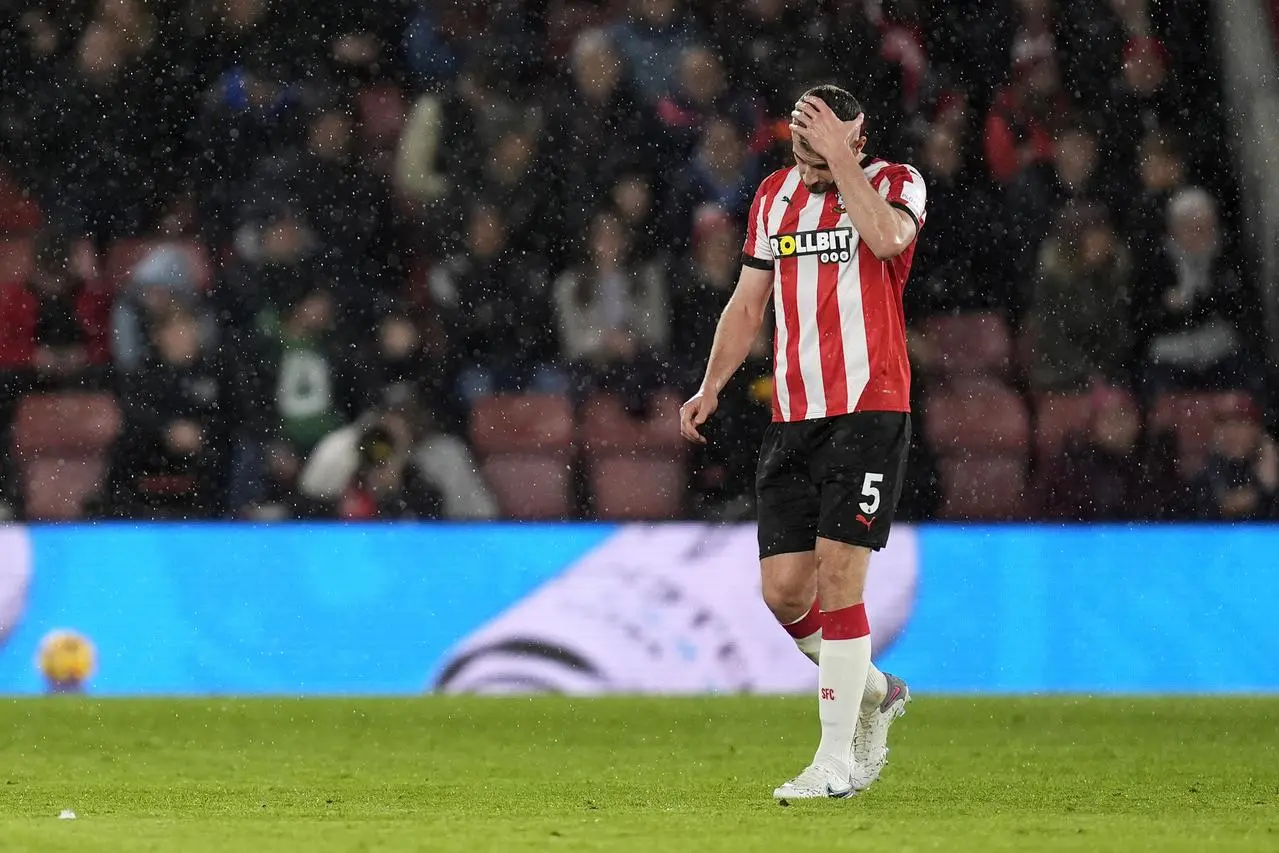 Jack Stephens puts his left hand over his face in disappointment 