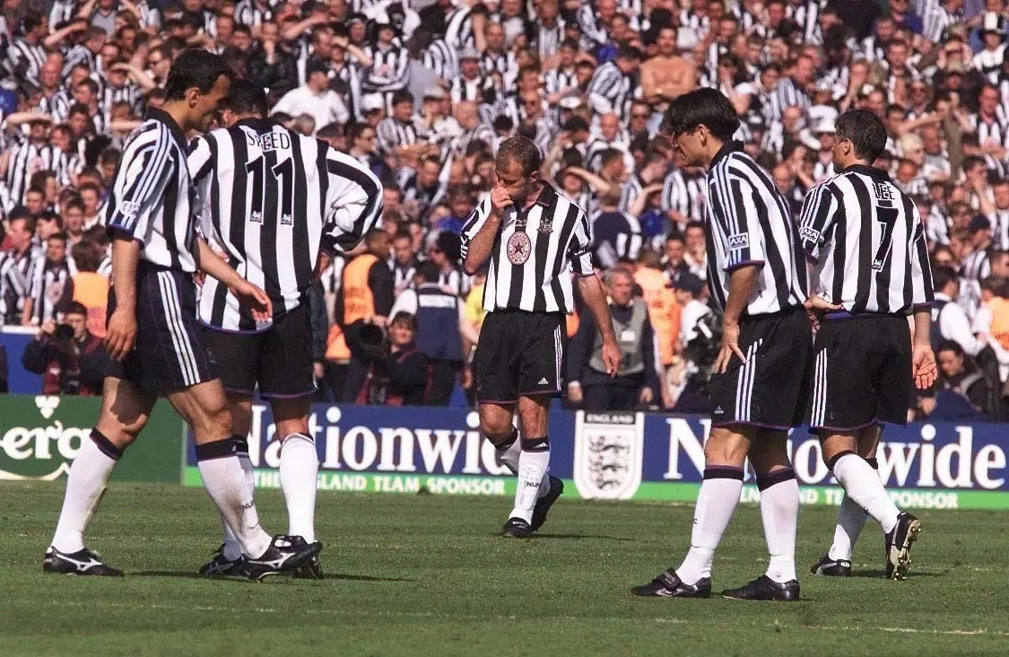 Newcastle's Alan Shearer (centre) looks dejected, following the 2-0 FA Cup final defeat by Manchester United