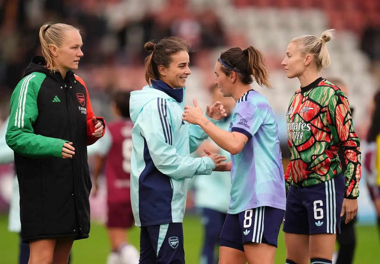  Slegers celebrates victory with Arsenal's Mariona Caldentey 