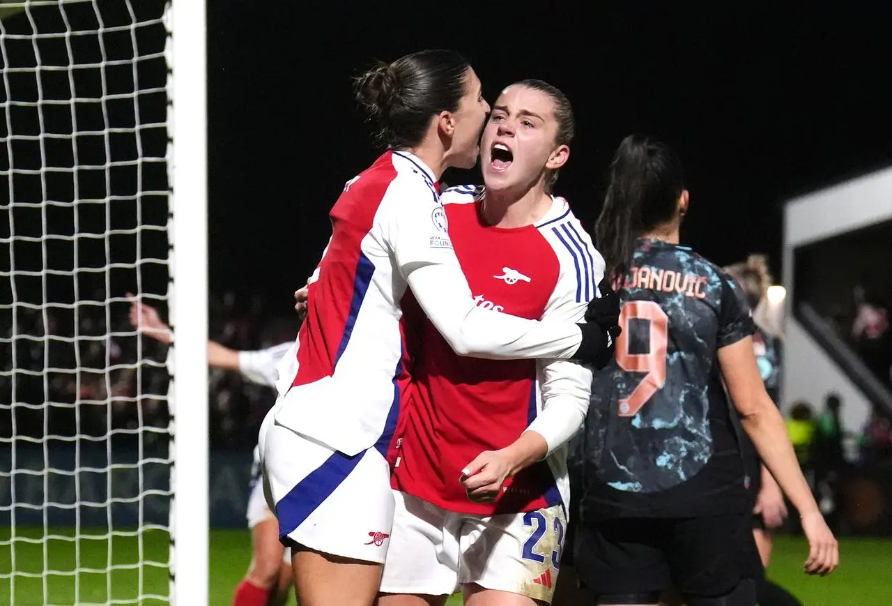 Arsenal’s Alessia Russo (facing) celebrates scoring their side’s second goal of the game with team-mate during the UEFA Women’s Champions League Group C match at Meadow Park, 