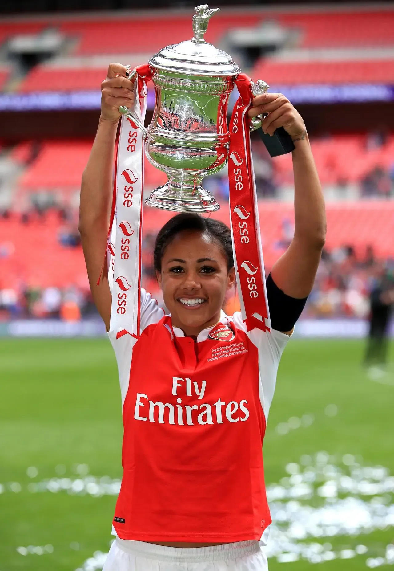 Scott holds the trophy and celebrates after winning the SSE Women’s FA Cup Final at Wembley Stadium, 