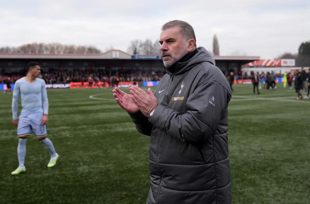 Tottenham manager Ange Postecoglou applauds the fans after full-time