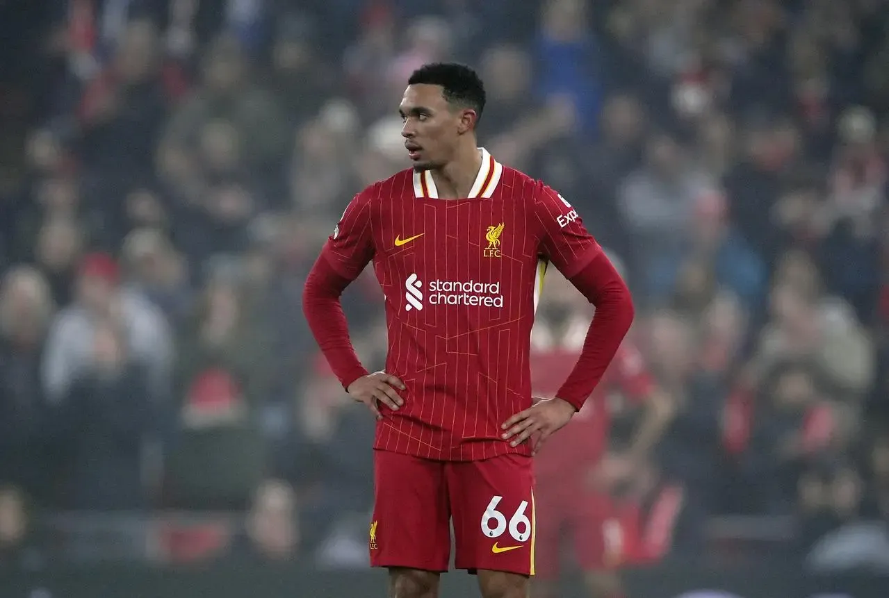 Liverpool's Trent Alexander-Arnold stands with hands on hips