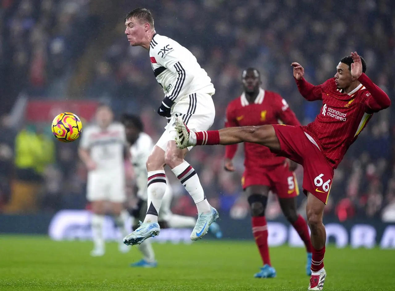 Manchester United’s Rasmus Hojlund (left) and Liverpool’s Trent Alexander-Arnold battle for the ball during the Premier League match at Anfield