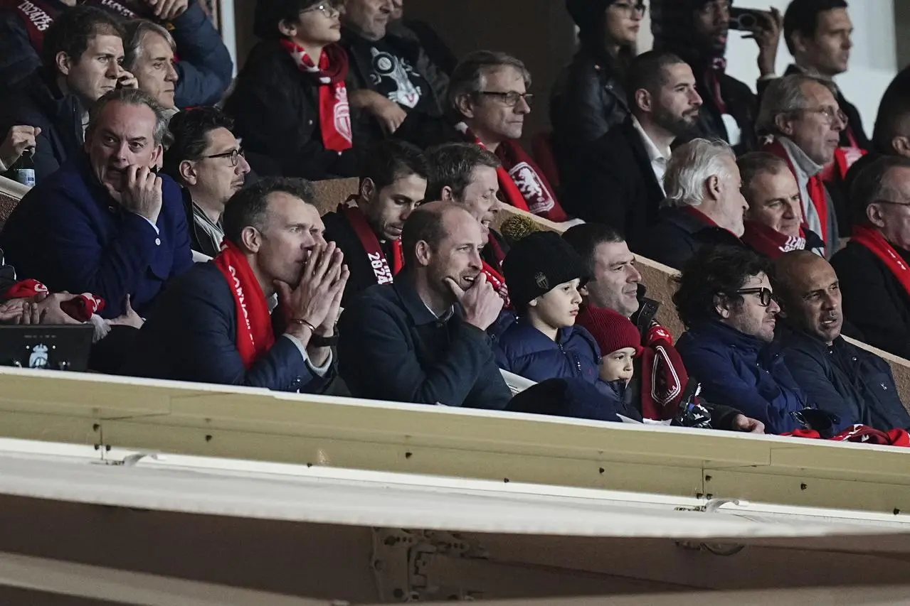 The Prince of Wales watches the action in the stand