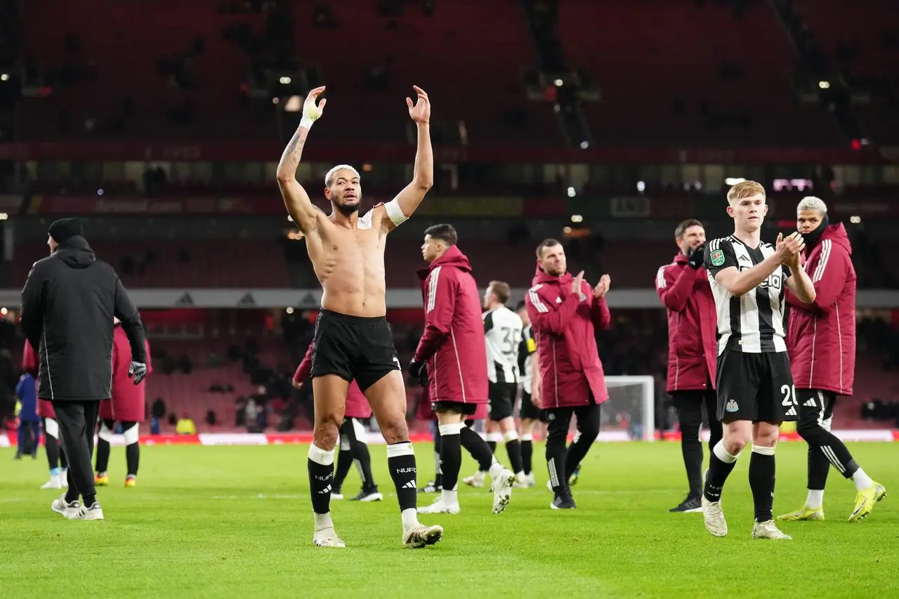 Newcastle players celebrate their win at the Emirates 