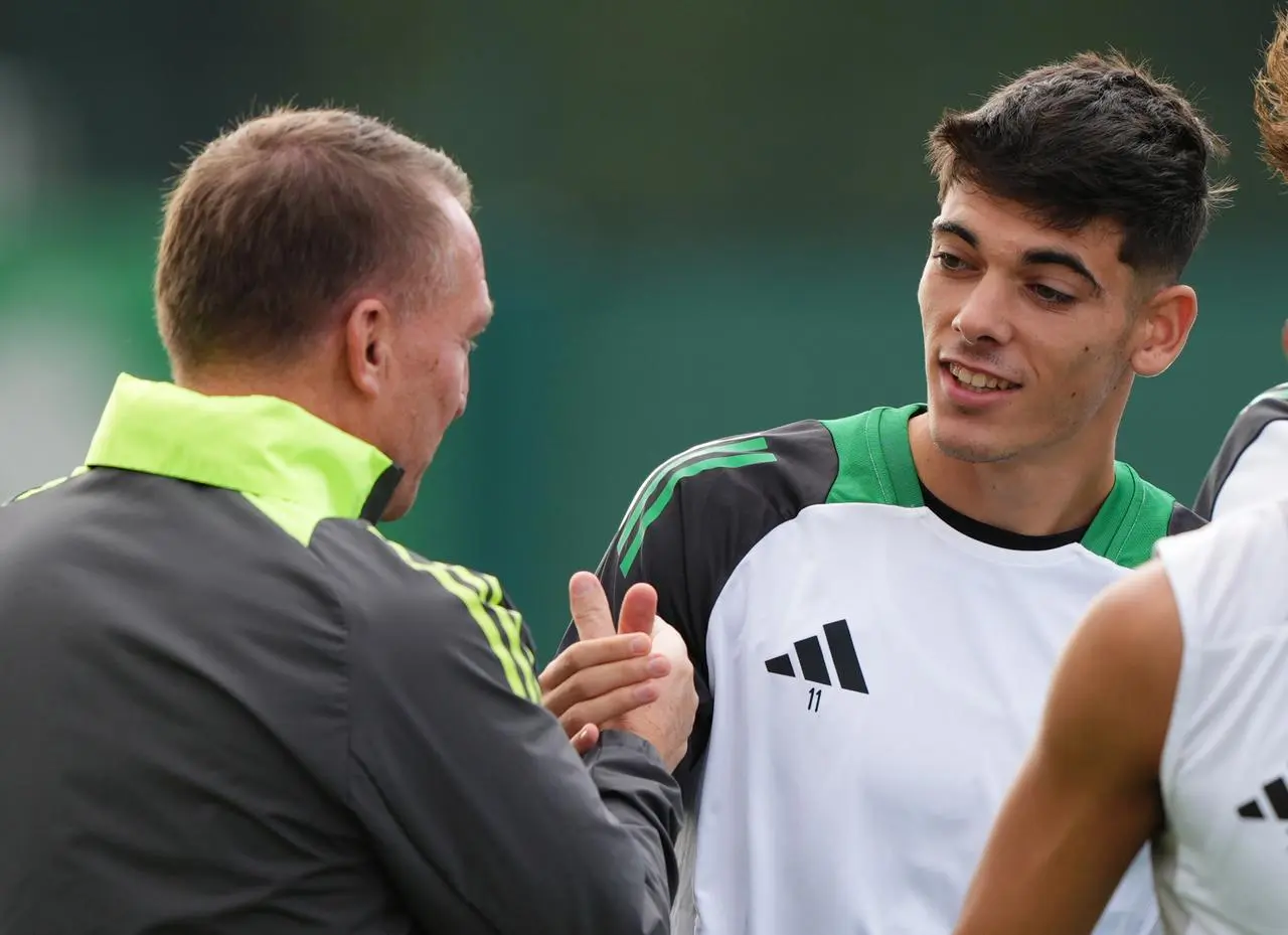 Brendan Rodgers shakes hands with Alex Valle