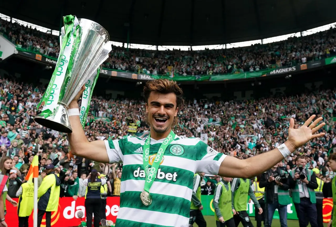 Jota holds the Premiership trophy