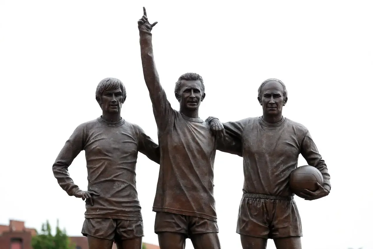 A statute of George Best, Denis Law and Bobby Charlton, Manchester United's 'Holy Trinity', stands outside Old Trafford