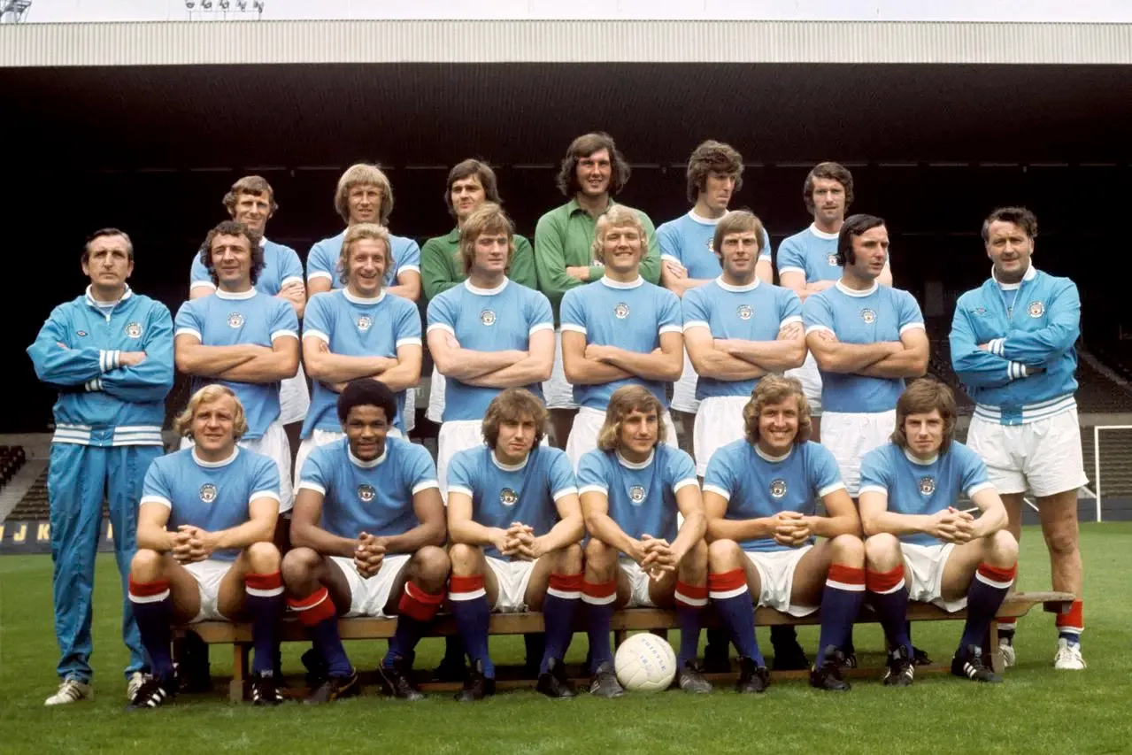 Manchester City first-team photograph: Back row (left to right) Tony Book, Colin Hall, Ron Healey, Joe Corrigan, Tommy Booth and Mike Doyle. Middle row: Ken Barnes (trainer), Mike Summerbee, Denis Law, Rodney Marsh, Colin Baratt, Alan Oakes, Glyn Pardoe, and Johnny Hart (Manager). Front row: Francis Lee, Tony Whelan, Derek Jeffries, Frank Carrodus, Tony Towers, and Willie Donachie