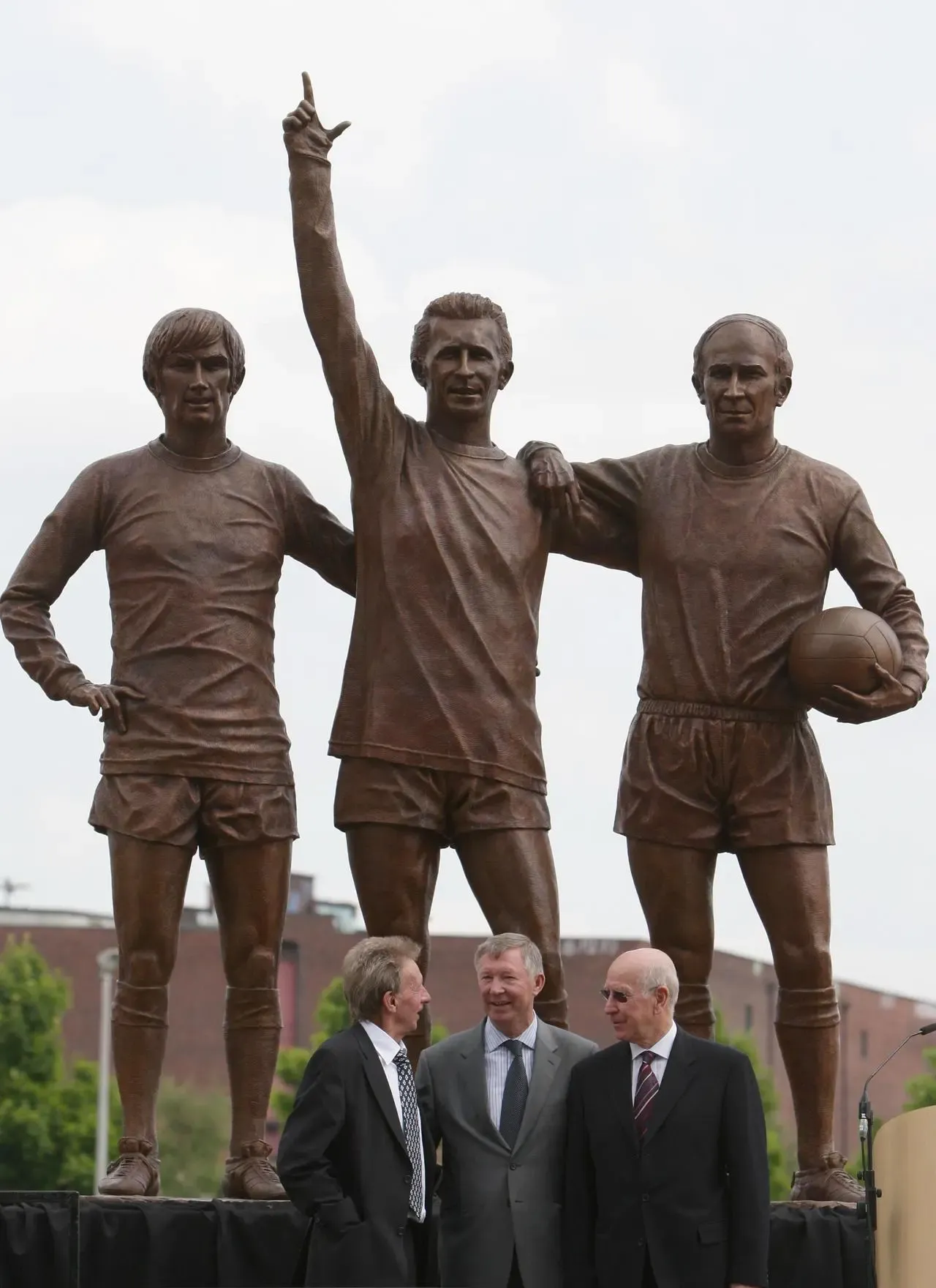 Denis Law (left to right), Sir Alex Ferguson and Bobby Charlton stand beneath the new ‘Holy Trinity’ statue at Old Trafford