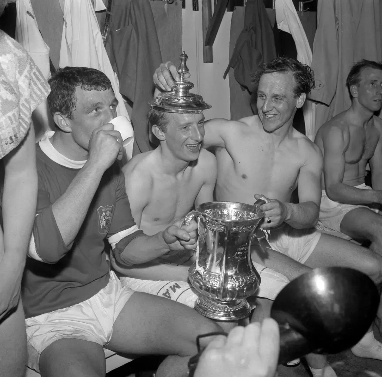 Manchester United’s (left to right) David Herd, Denis Law and Maurice Setters celebrate with the FA Cup