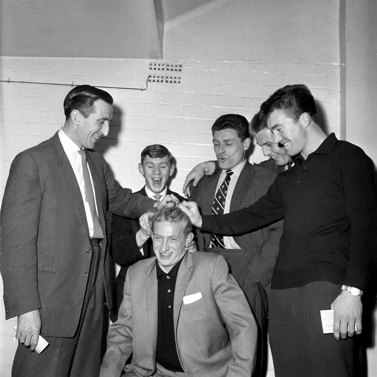 Denis Law, Britain’s costliest footballer, celebrates his 21st birthday with his team-mates at Maine Road