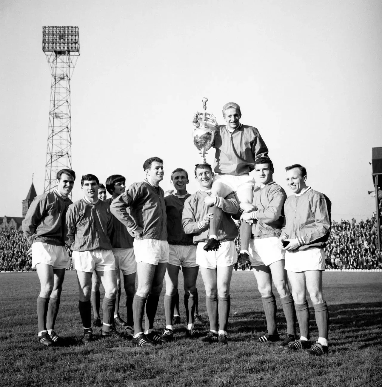 Denis Law holds the Football League Cup 