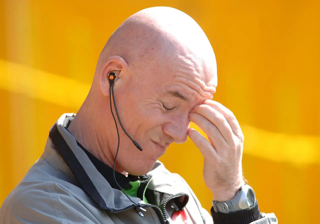 Dermot Gallagher scratches his face during a top-flight match between Watford and Portsmouth