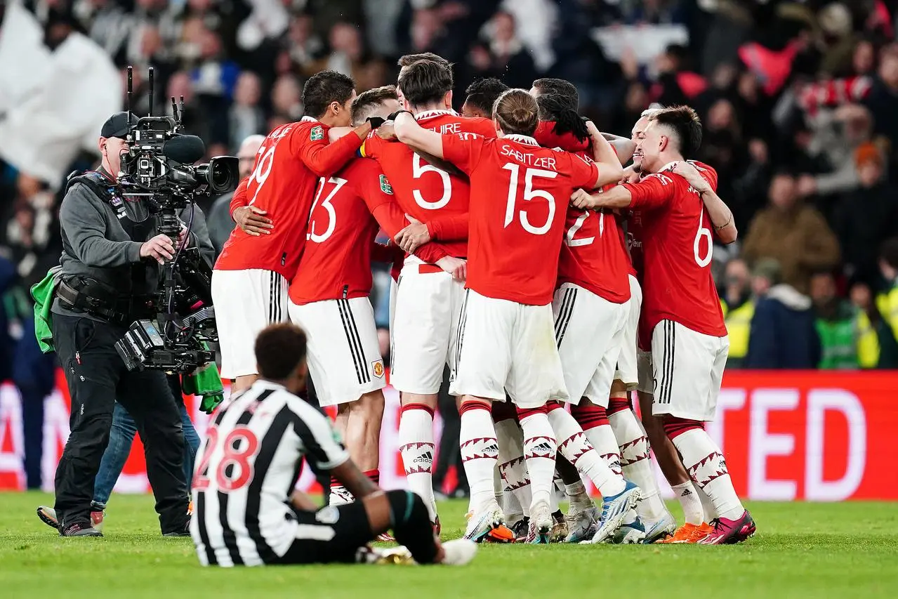 Manchester United players celebrate victory over Newcastle in the 2023 Carabao Cup final