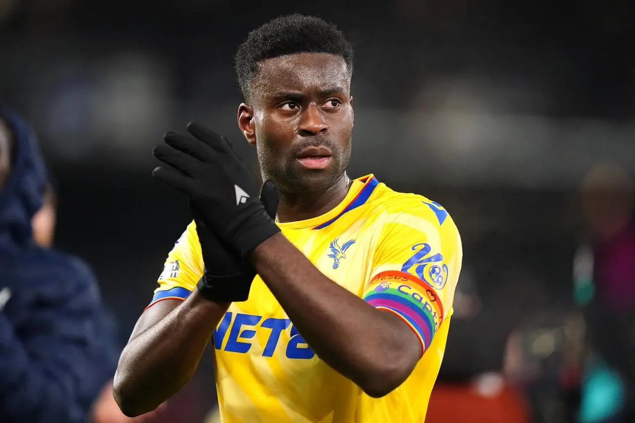 Crystal Palace’s Marc Guehi applauds the fans following Premier League victory at Ipswich