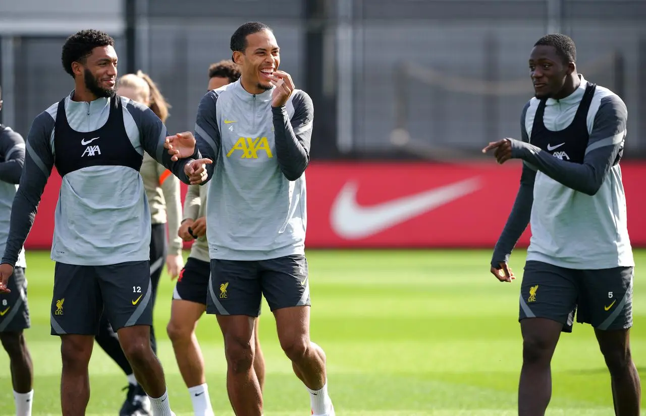 Liverpool’s Joe Gomez, Virgil van Dijk and Ibrahima Konate share a joke at training