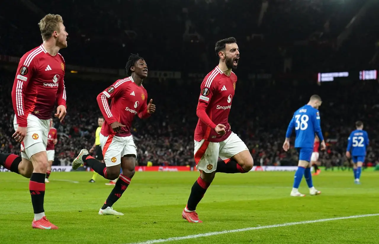 Manchester United’s Bruno Fernandes (right) celebrates scoring against Rangers in the Europa League