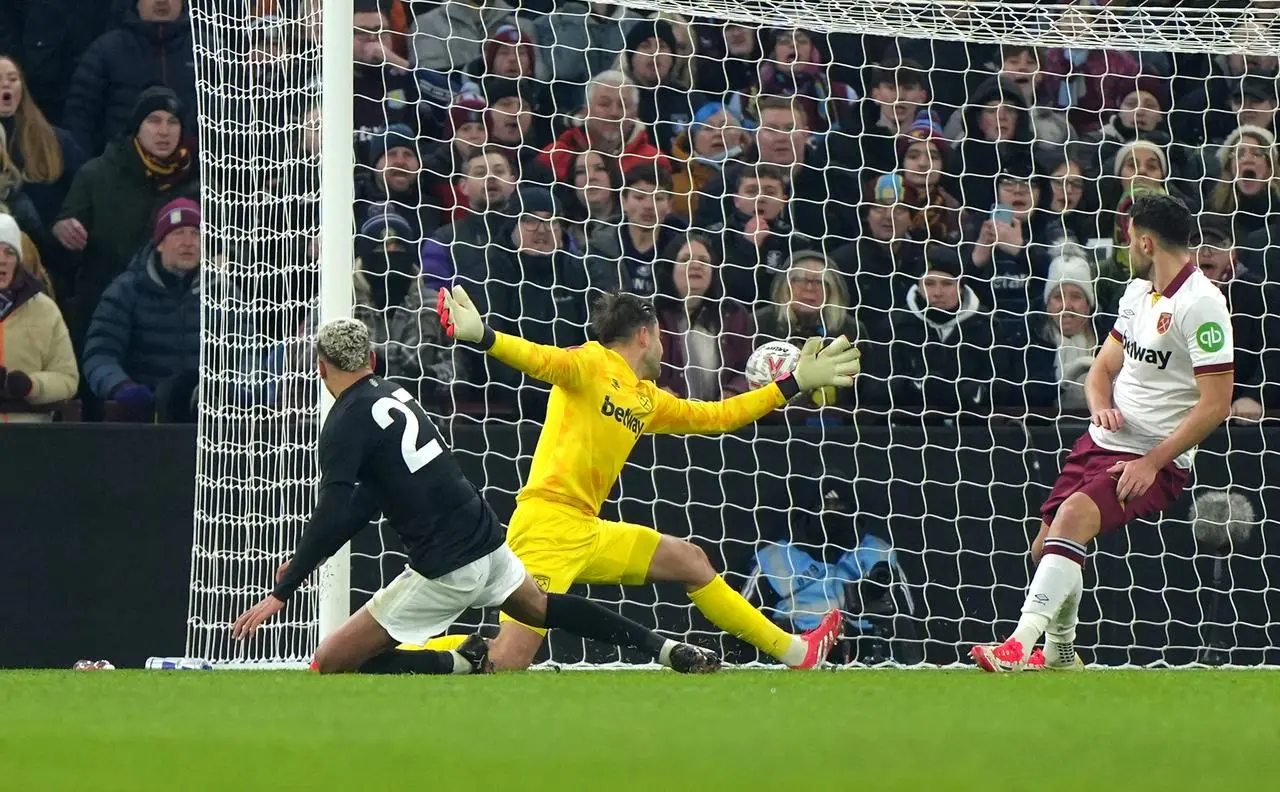 Aston Villa's Morgan Rogers shots past the West Ham goalkeeper to put his side ahead