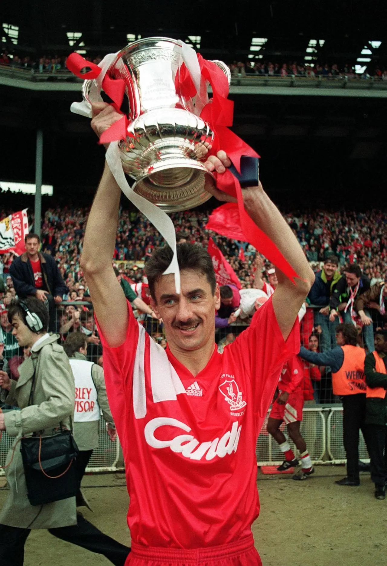 LIverpool striker Ian Rush holds up the FA Cup