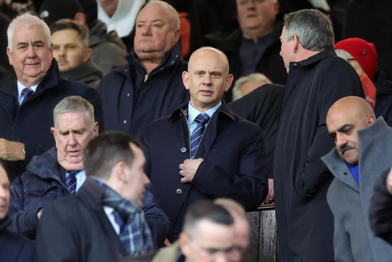 Rangers chief executive Patrick Stewart, centre, in the stands at Ibrox