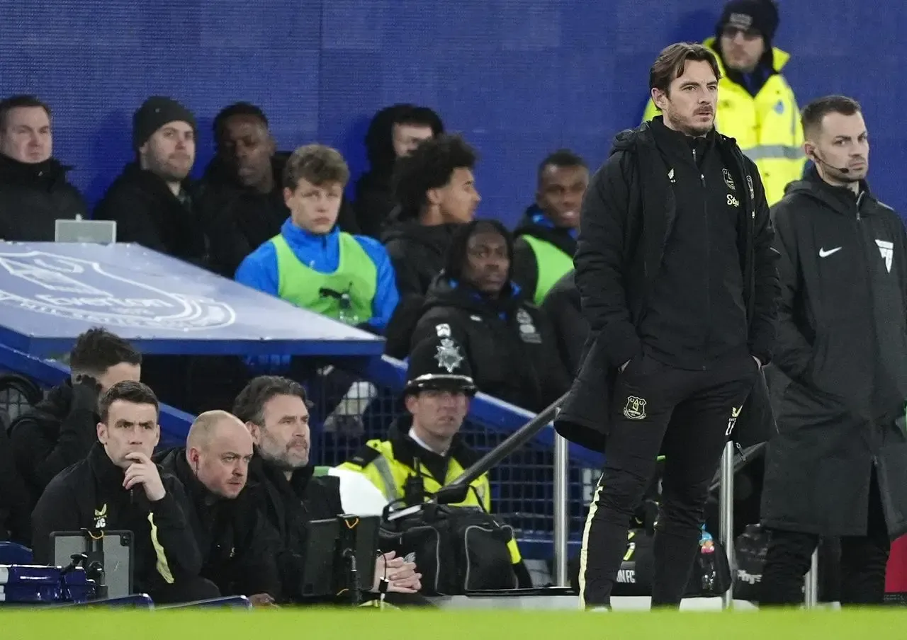 Everton interim manager Leighton Baines (right) on the touchline