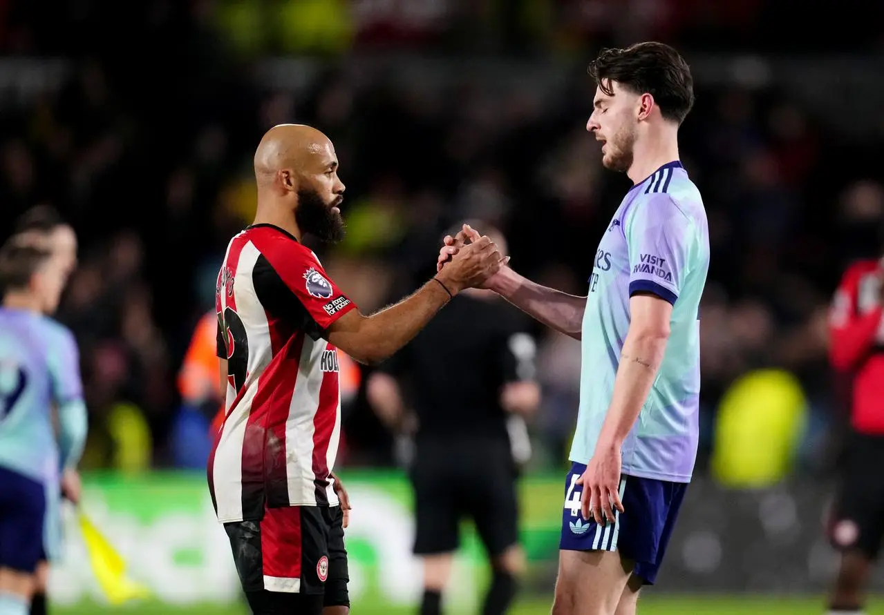 Declan Rice and Bryan Mbeumo shake hands