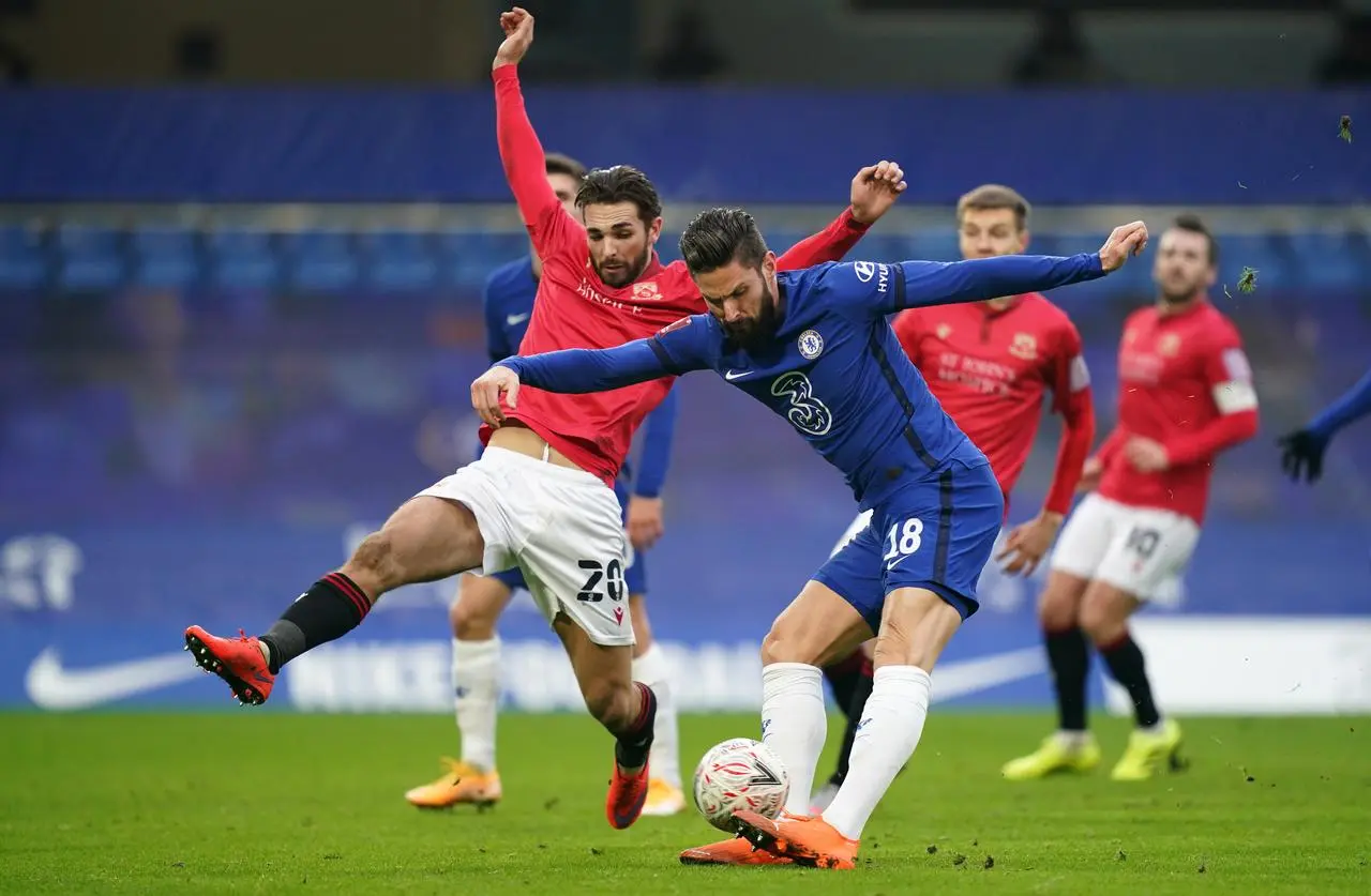 Morecambe’s Adam Phillips attempts to block a shot from Chelsea’s Olivier Giroud in the 2021 FA Cup third-round tie at Stamford Bridge (John Walton/PA)