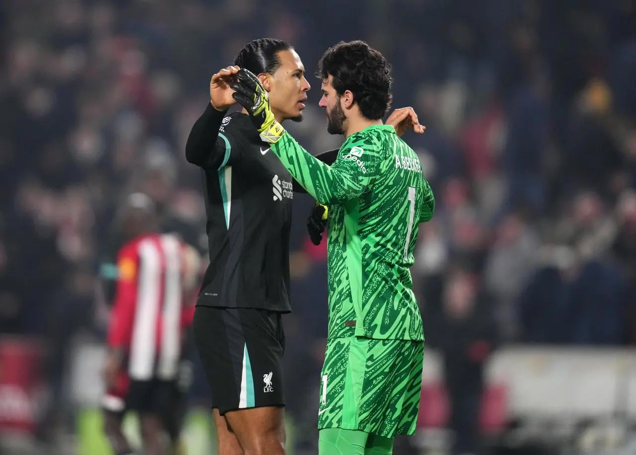 Van Dijk and Alisson celebrate