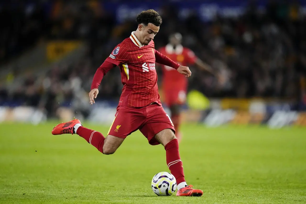 Liverpool midfielder Curtis Jones kicks a ball