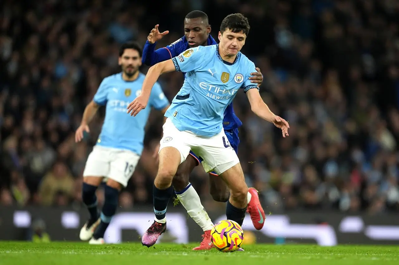 Manchester City’s Abduqodir Khusanov (right) and Chelsea’s Nicolas Jackson battle for the ball 