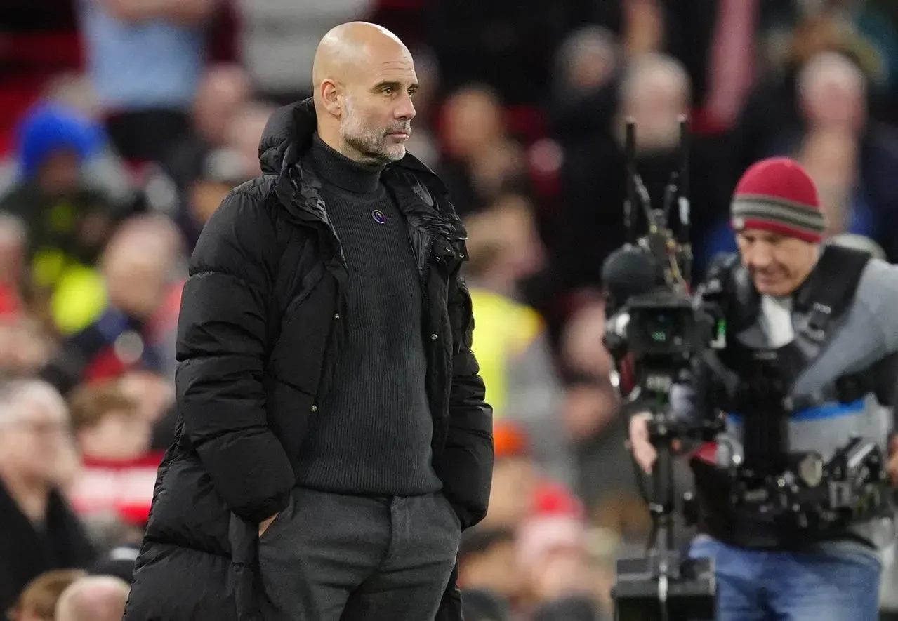 Guardiola watches his team from touchline (Peter Byrne/PA)