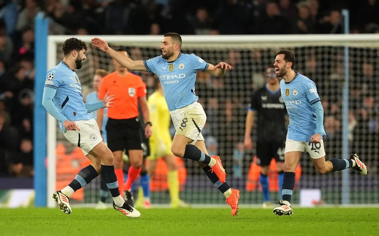 Manchester City’s Mateo Kovacic (centre) celebrates scoring their side’s first goal against Club Brugge