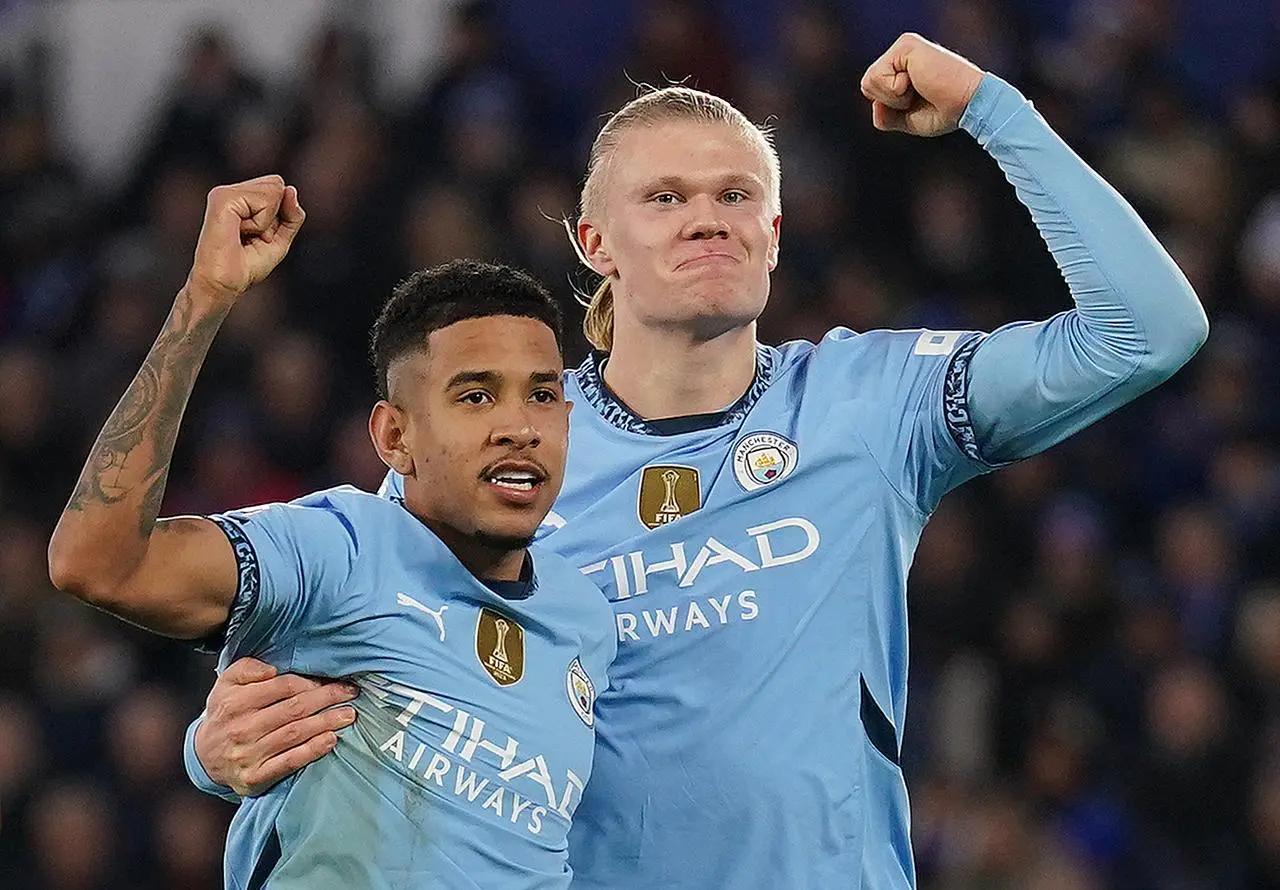 Savinho (left) and Erling Haalanf (right) celebrate a Manchester City goal by raising fists together