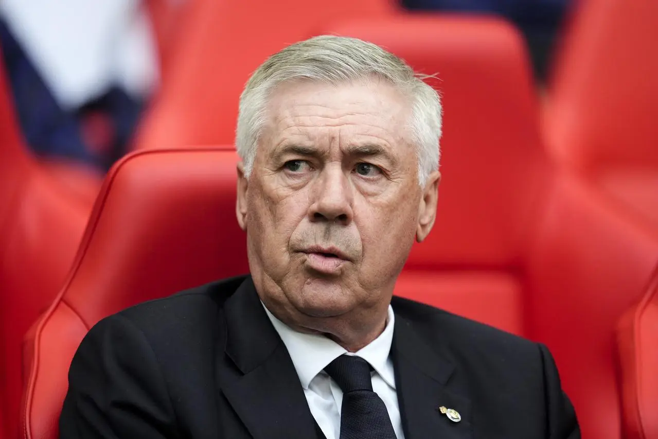 Real Madrid manager Carlo Ancelott sits in the dugout