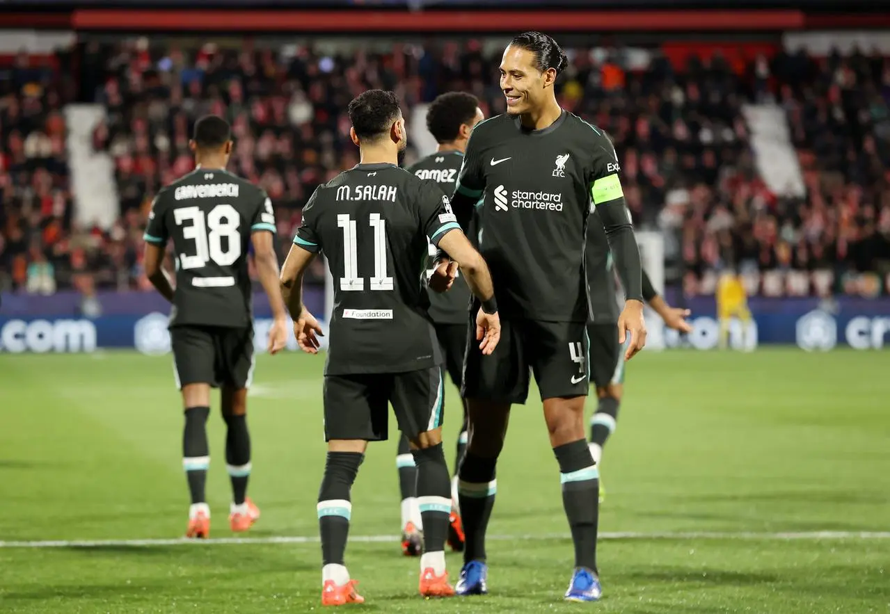 Liverpool’s Mohamed Salah celebrates with Virgil van Dijk