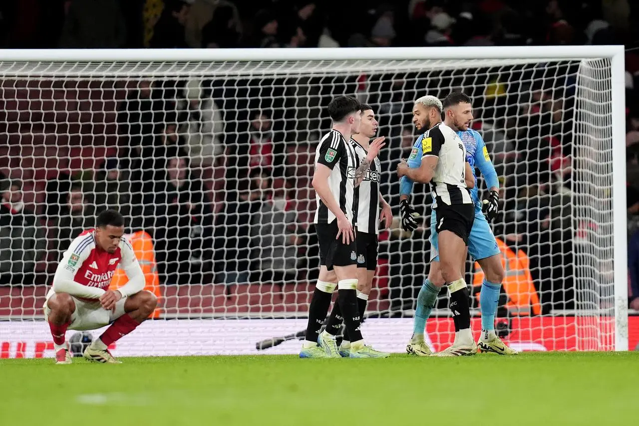 Newcastle players celebrate their win over Arsenal 