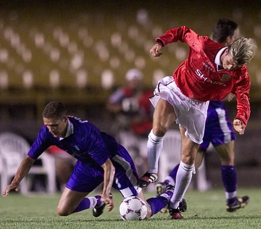 David Beckham battles for the ball with a South Melbourne player