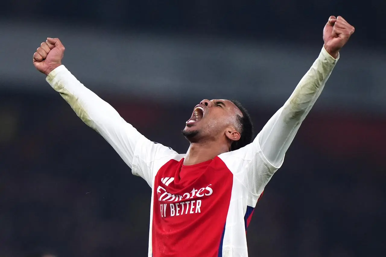 Arsenal's Gabriel raises his arms in celebration