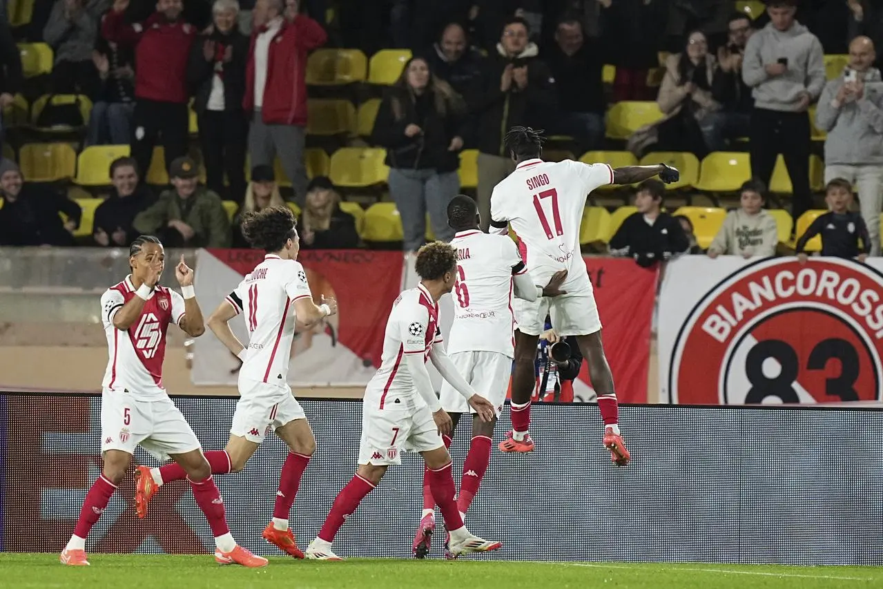 Monaco’s Wilfried Singo, right, celebrates after scoring the only goal 