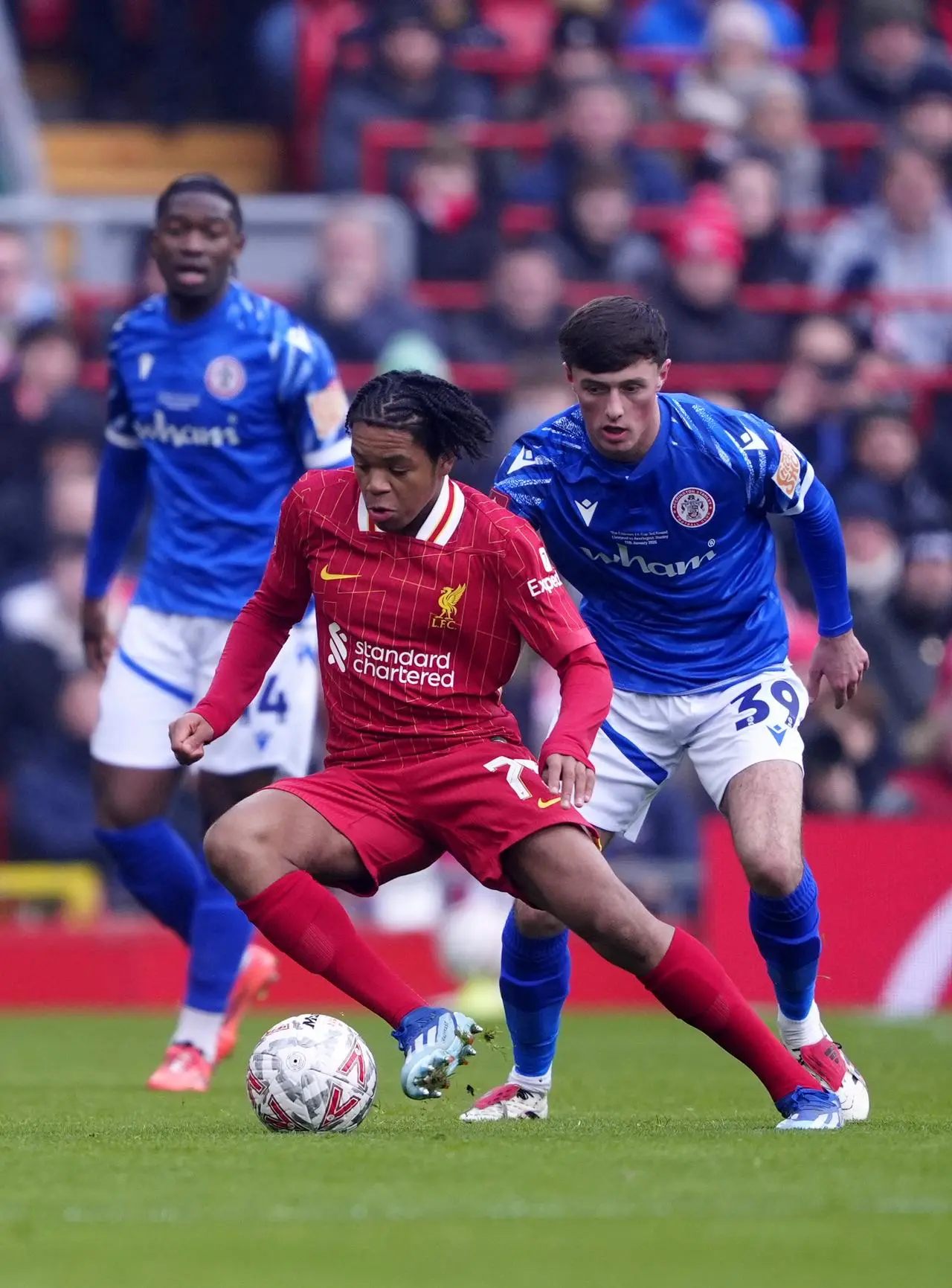 Liverpool’s Rio Ngumoha holds off Accrington Stanley’s Josh Wood